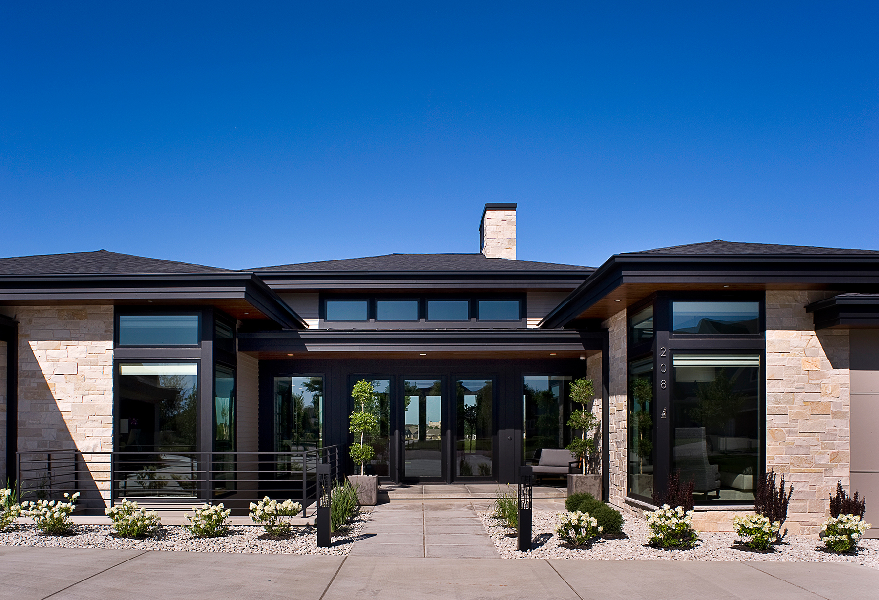 exterior of dark modern house with clean lines and large windows