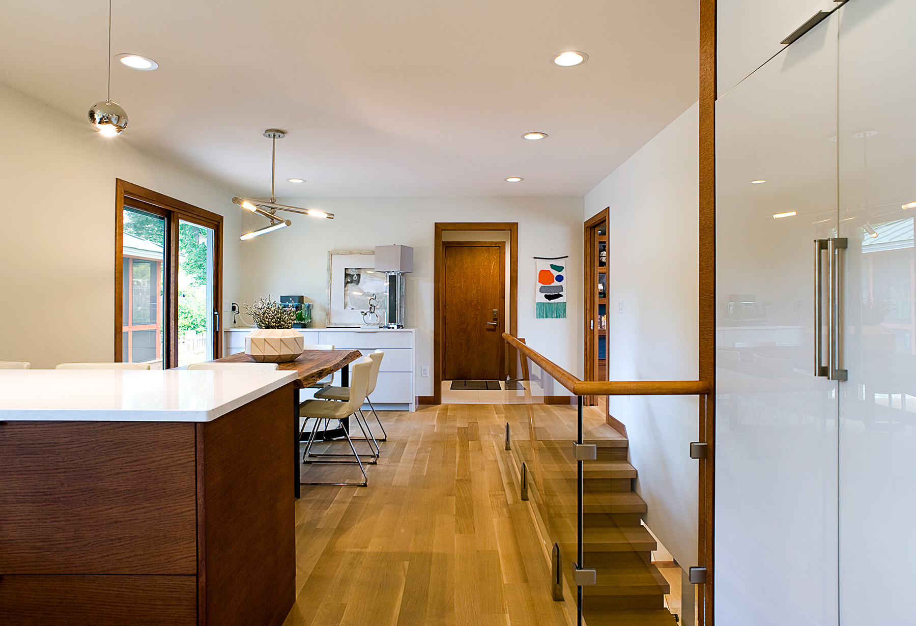 mid-century dining room with stairs going down to the basement