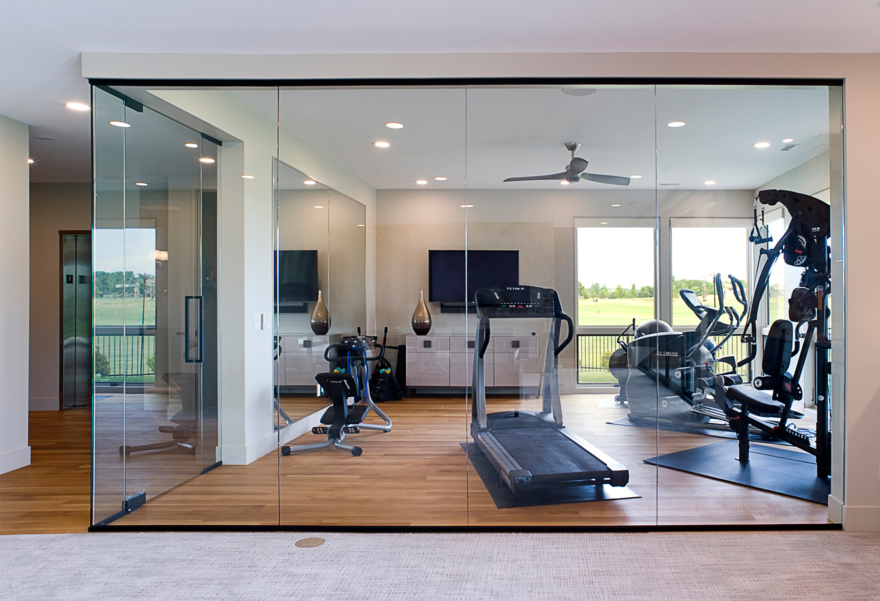 home gym with glass walls