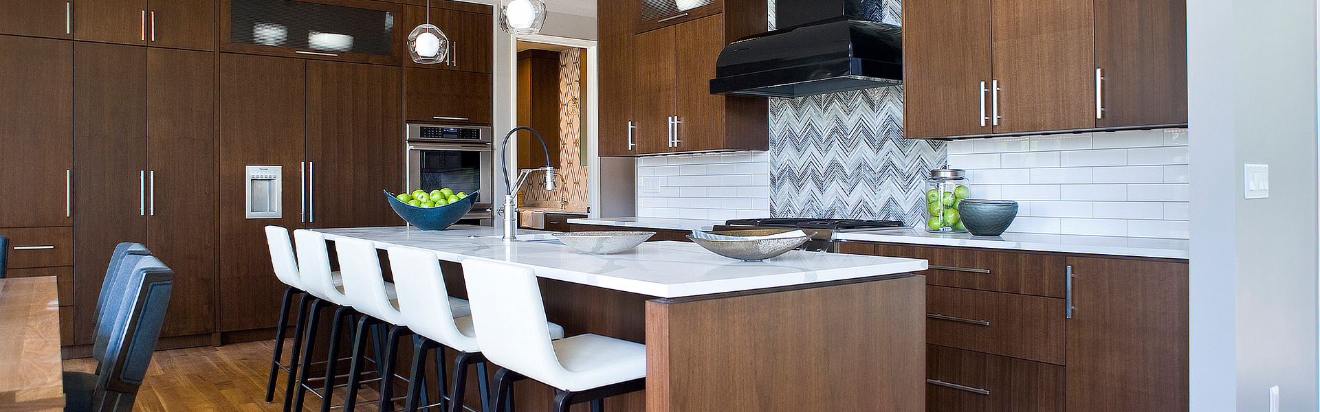 modern kitchen with wood cabinets and marble countertops